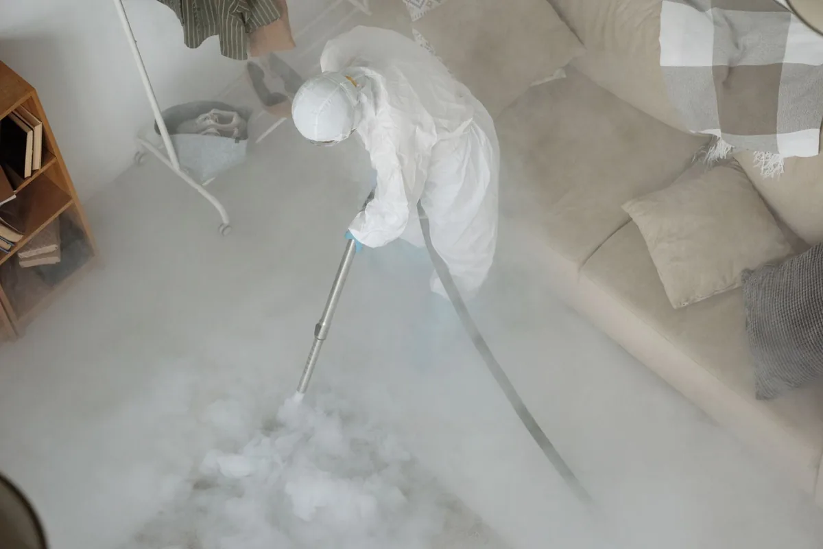 Biohazard cleanup technician in protective equipment, Brooklet, GA